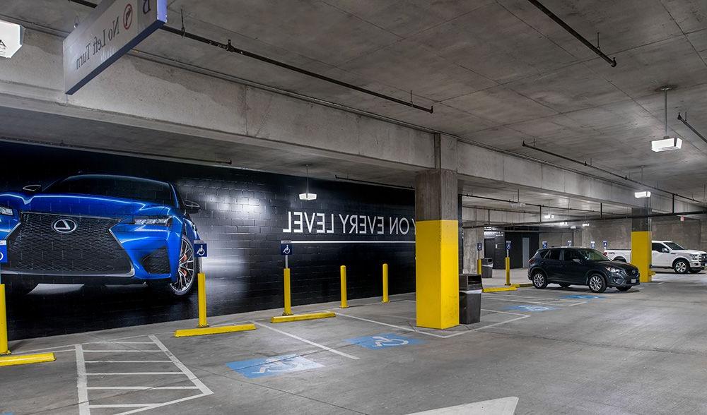 American Airlines Center parking structure in Dallas, TX with bright, high quality lighting from parking garage LED light fixtures in the handicap section.